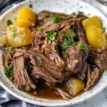 mississippi pot roast instant pot recipe 1 Tender Mississippi Pot Roast served with gravy, pepperoncinis, and mashed potatoes, made in an Instant Pot.